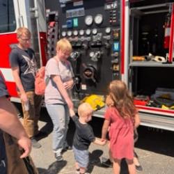 Children learn about the work of a firefighter