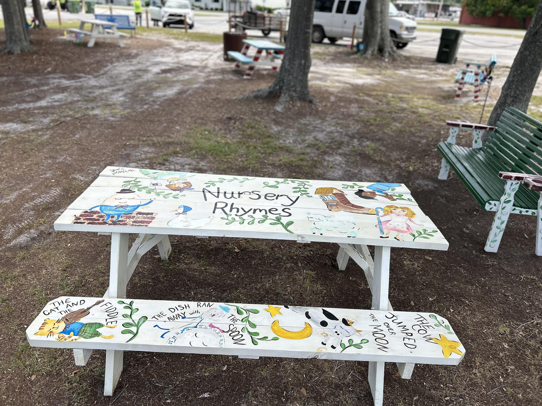 Storybook park, decorated picnic tables