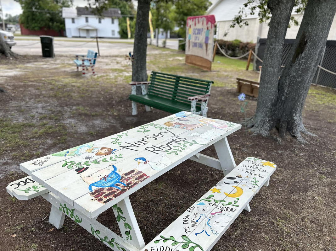 Storybook park, decorated picnic tables