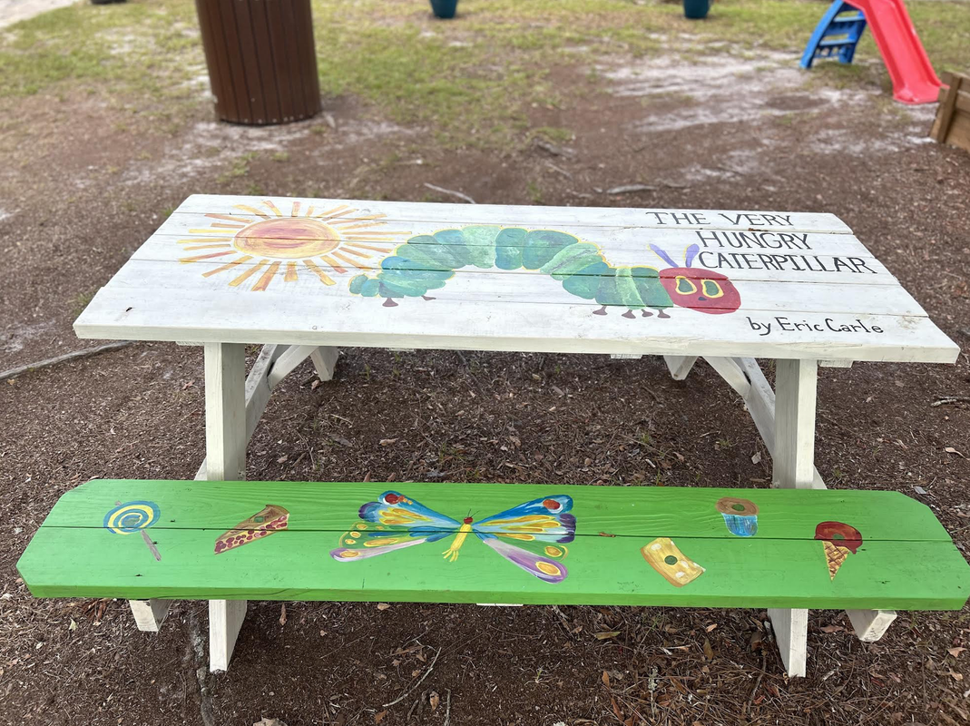 Storybook park, decorated picnic tables