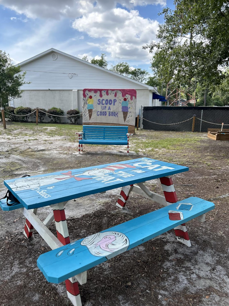 Storybook park, decorated picnic tables and benches